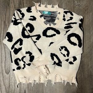 Distressed animal print sweater